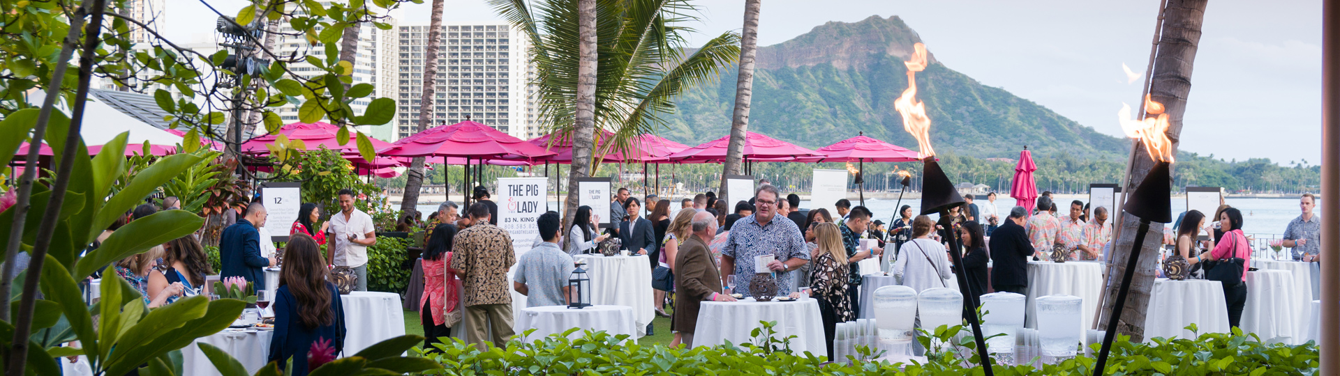 Alumni event at the Royal Hawaiian, Diamond Head in the background.
