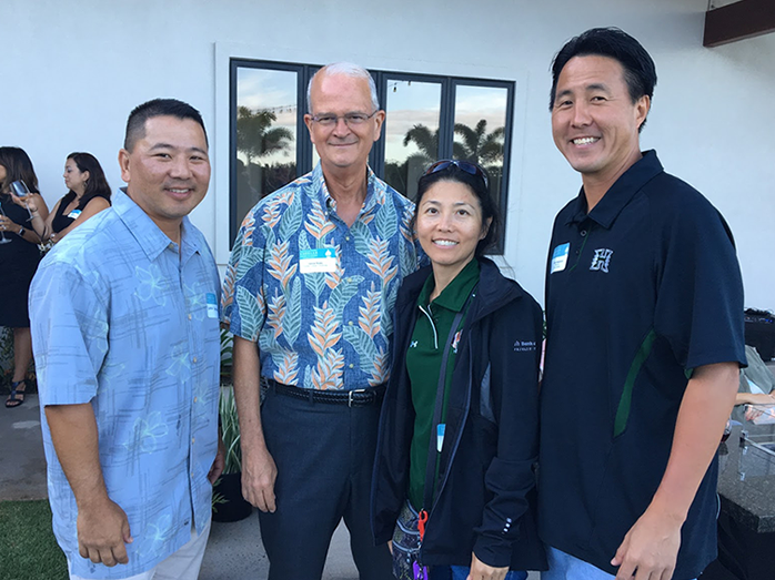 Shidler alumni pictured with Dean Vance Roley