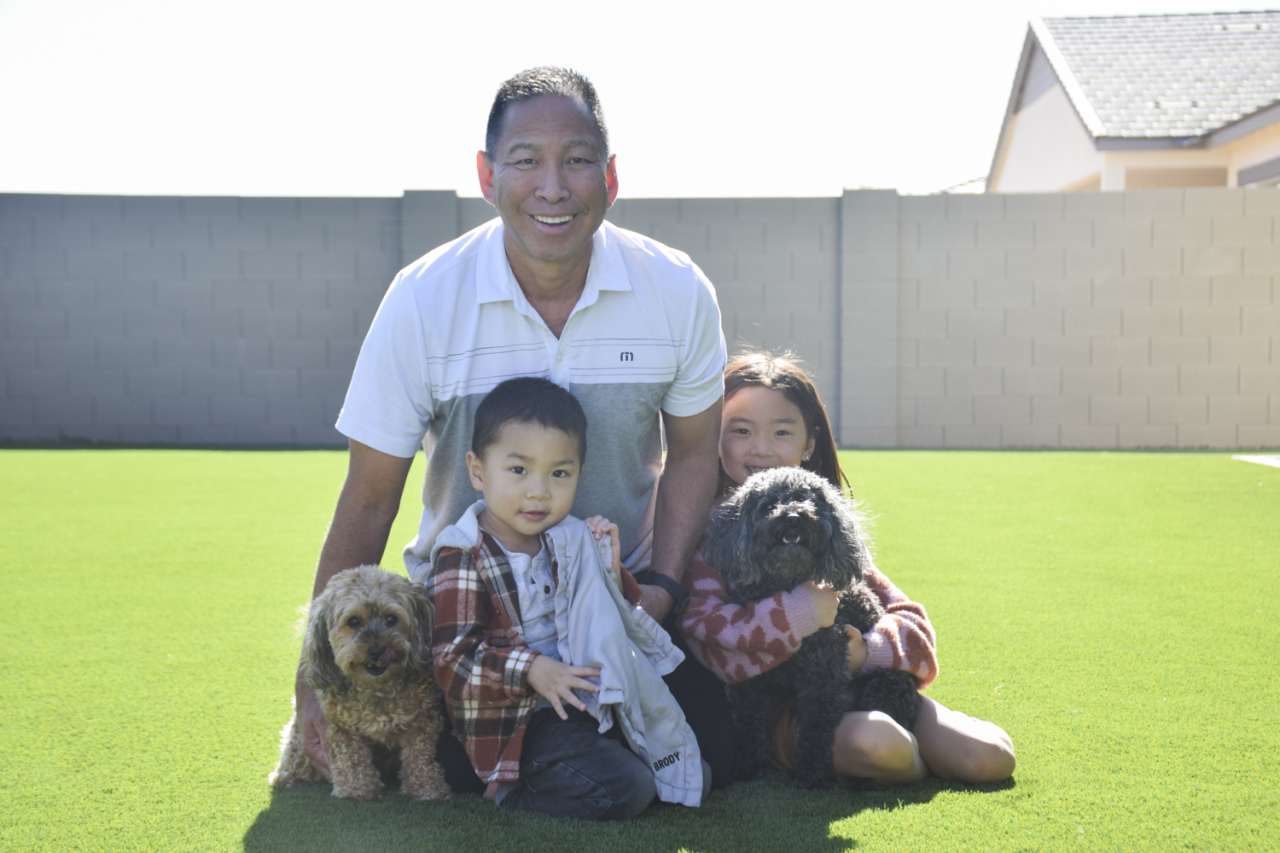 Ren pictured with his hanai niece, nephews and dogs in Arizona.